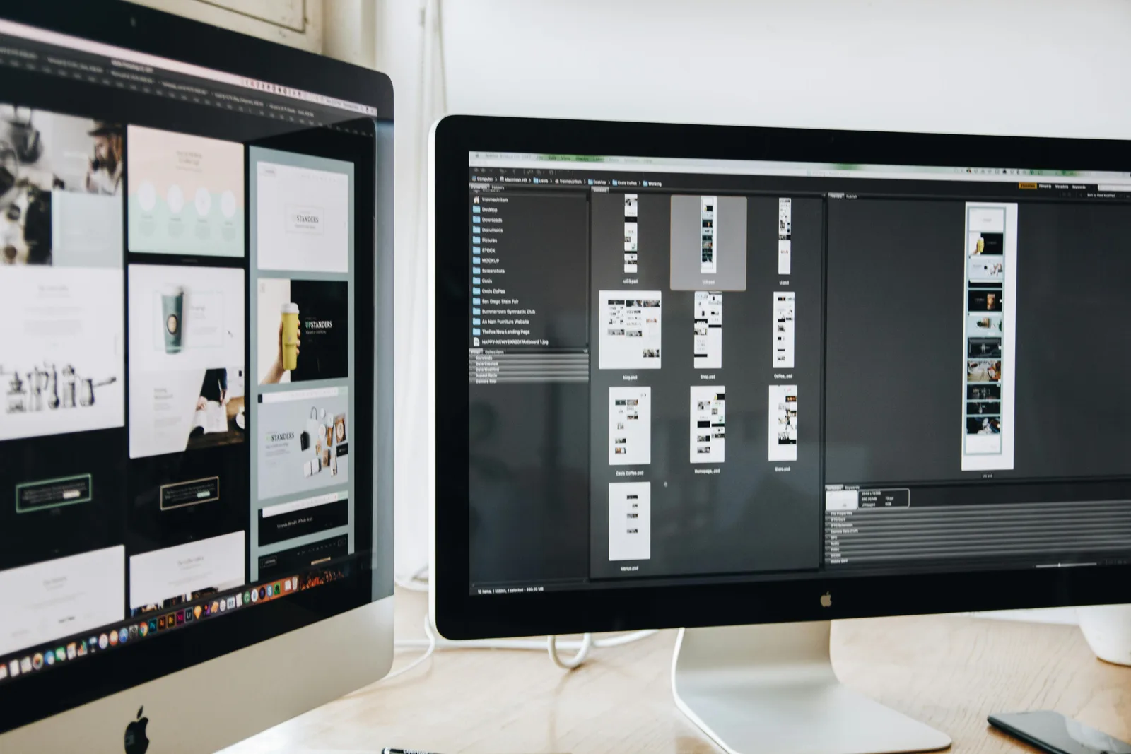 Two monitors displaying web design software